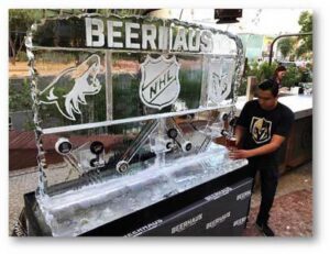 man pours drink working beer tap ice sculpture vegas